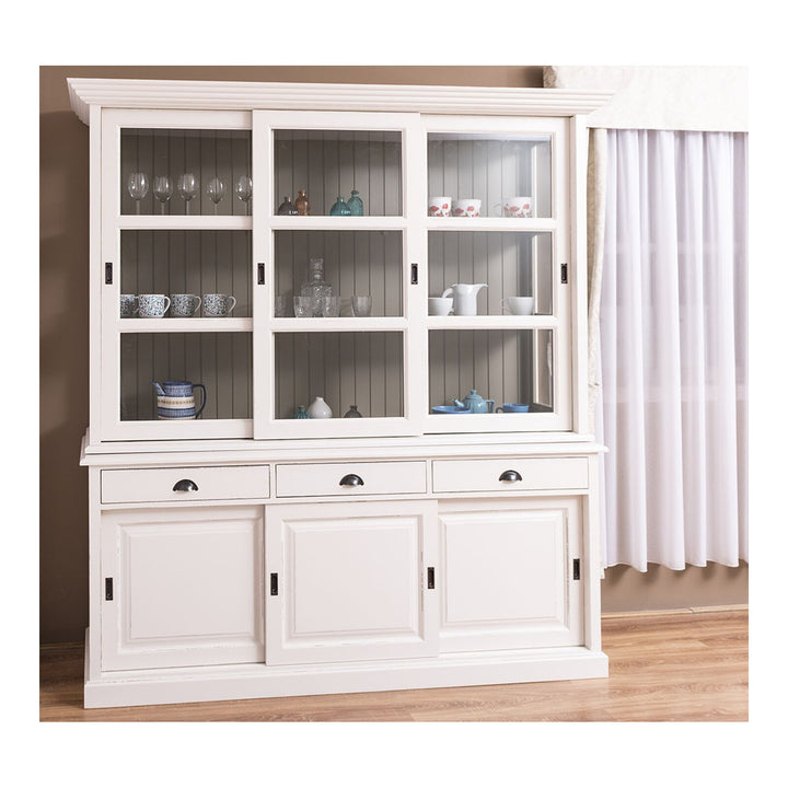 Bibliothèque en pin massif blanc avec trois portes vitrées coulissantes et buffet bas, vue de face