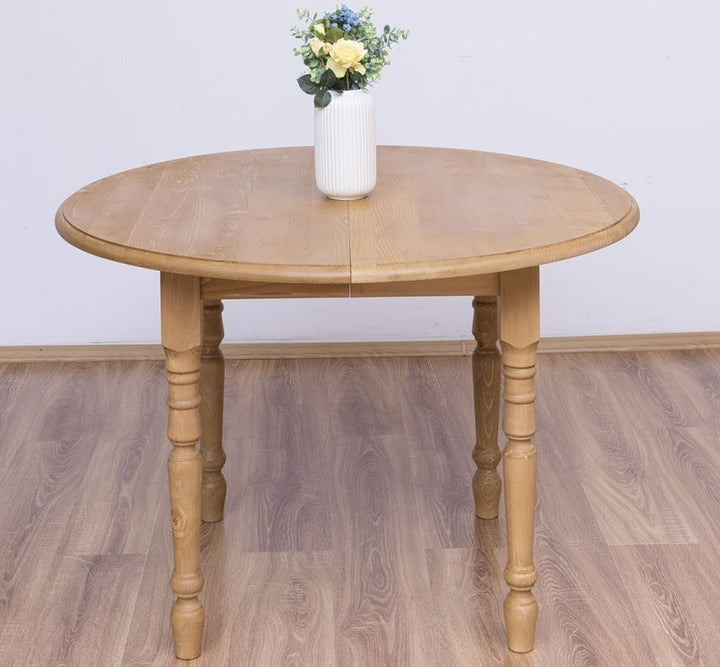 Table ronde extensible en pin massif avec plateau en pin, vue de face
