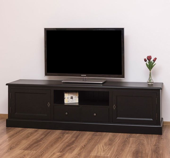 Meuble TV en bois massif noir avec 2 portes et 2 tiroirs en situation