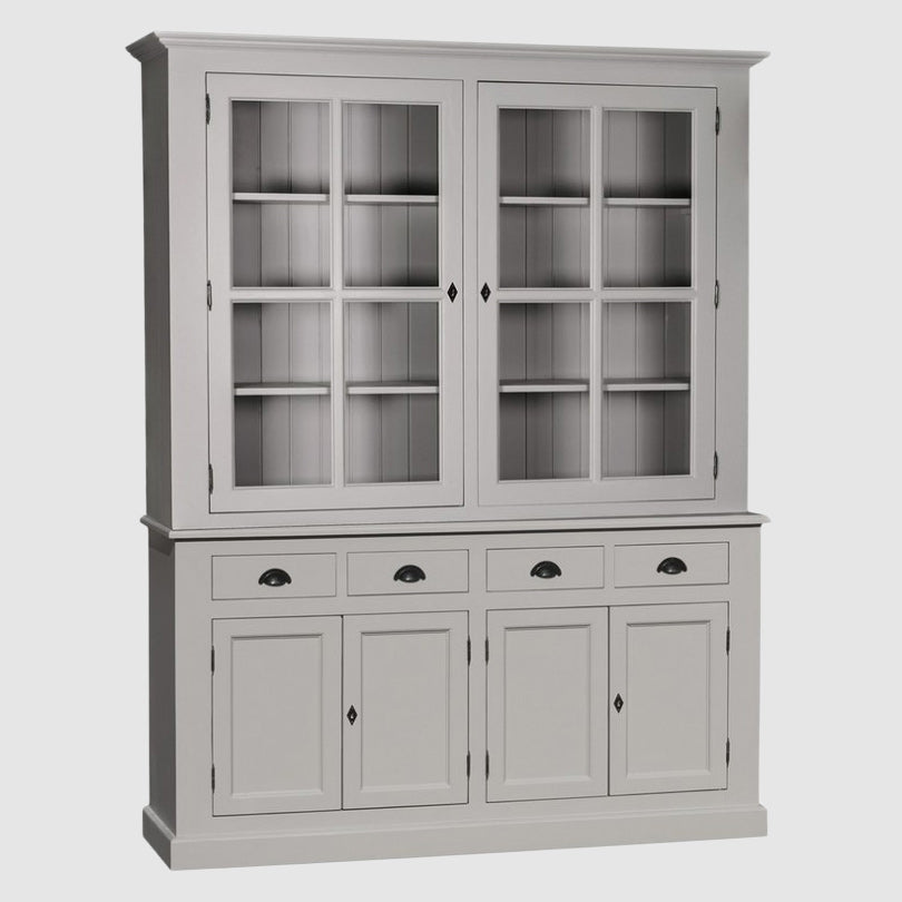 Vaisselier avec partie haute composée de deux portes vitrées à carreaux laissant apparaître des étagères intérieures, et partie basse avec quatre tiroirs alignés au-dessus de quatre portes pleines de rangement.