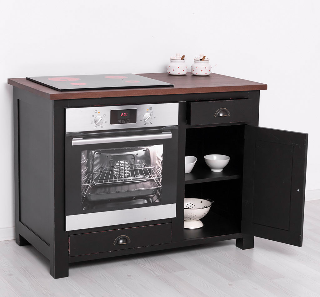 Meuble de cuisine noir avec plateau en bois foncé, tiroir supérieur et porte latérale ouverts, présenté dans une pièce lumineuse avec des pots à épices sur le dessus.
