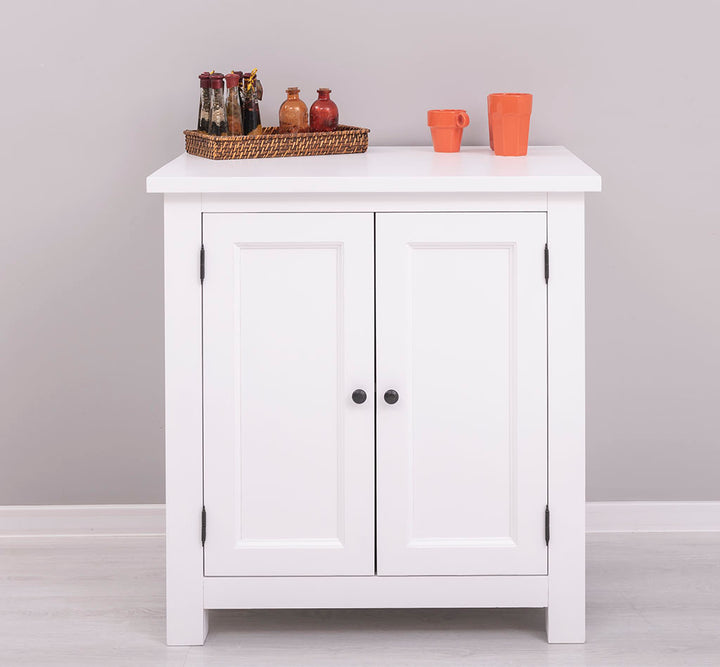 Variante du meuble en version entièrement blanche avec plateau blanc, présenté de face avec des accessoires de décoration et tasses orange sur le dessus.