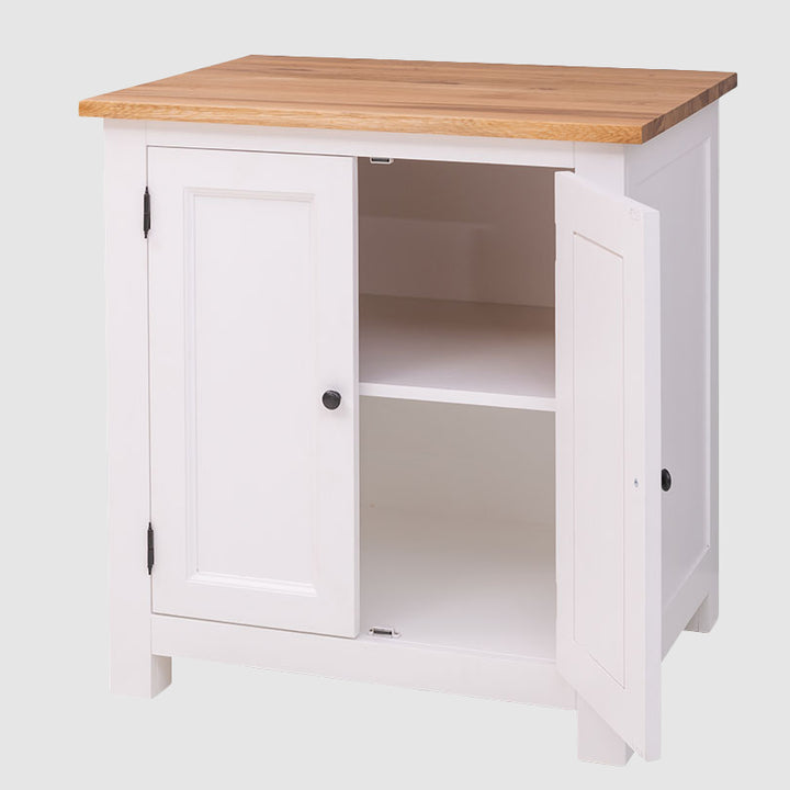 Meuble de rangement blanc à deux portes dont une est ouverte, laissant apparaître une étagère de séparation intérieure blanche sous un plateau en bois.