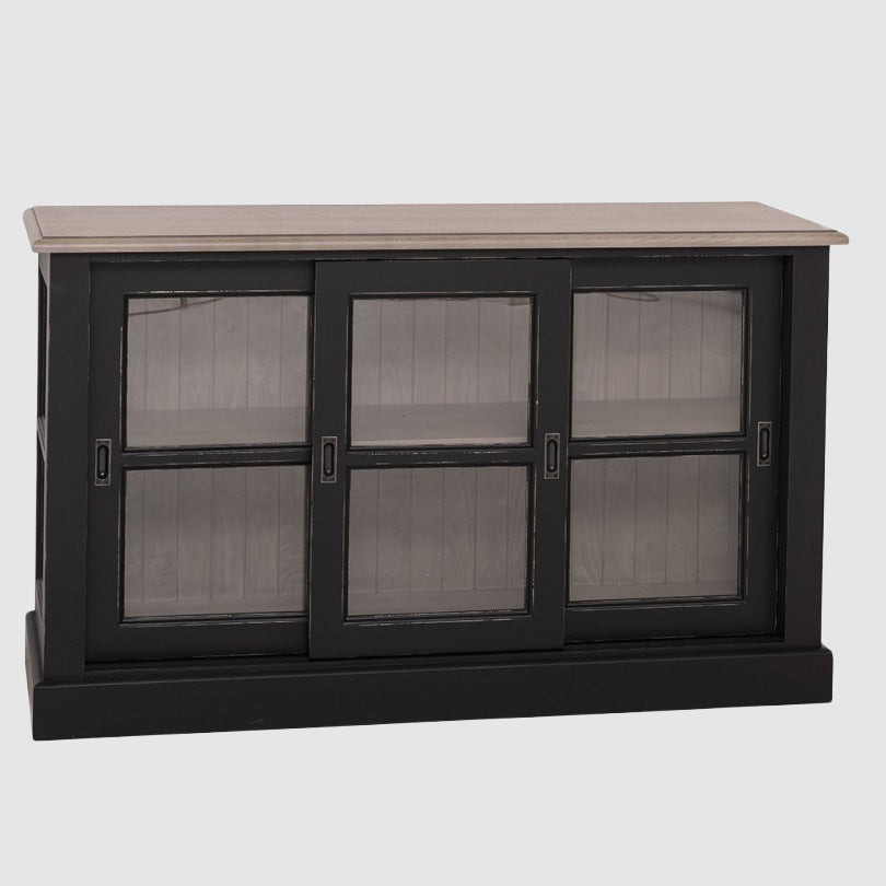 Buffet bas avec trois portes coulissantes vitrées, structure noire et plateau en chêne, présenté sur fond neutre.