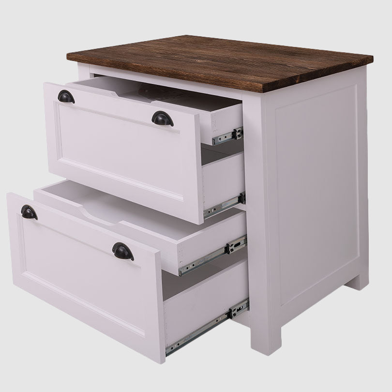 Meuble bas de cuisine en pin massif avec deux tiroirs ouverts montrant les glissières métalliques.