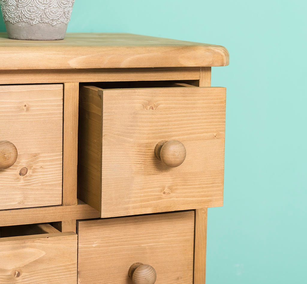 chiffonnier 8 tiroirs en pin massif finition ciré miel clair