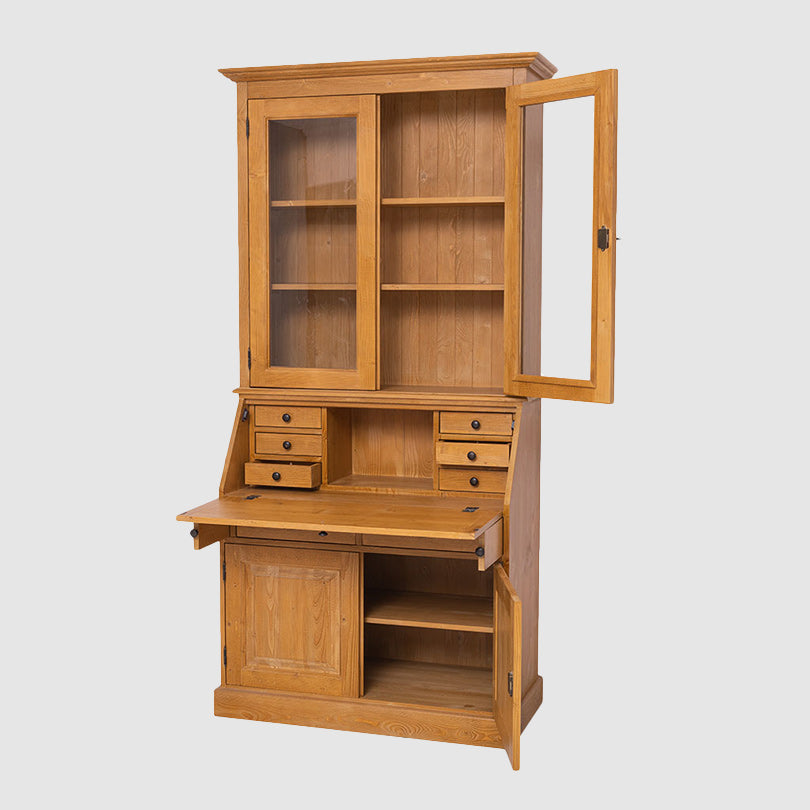 Secrétaire à abattant en pin massif finition ciré miel clair avec abattant ouvert et vitrine 2 portes vitrées, largeur 110 cm.
