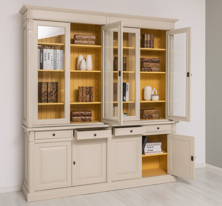 Bibliothèque en pin massif style Directoire avec portes vitrées et tiroirs ouverts, intérieur jaune visible