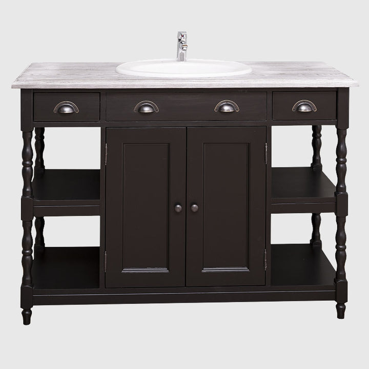 Meuble de salle de bain en bois noir avec vasque encastrée blanche et plateau effet bois vieilli.