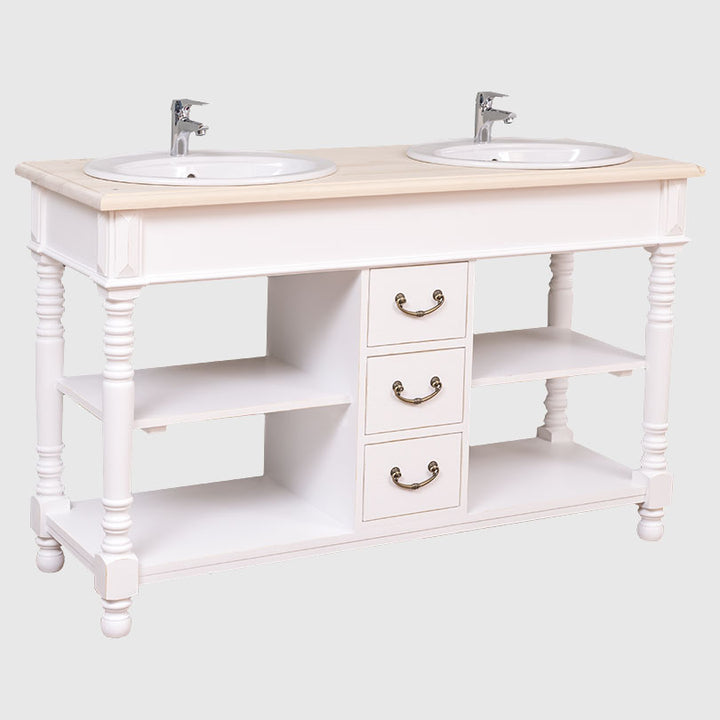 Meuble de salle de bain blanc à double vasque présentant des colonnes sculptées et un large espace de rangement ouvert.