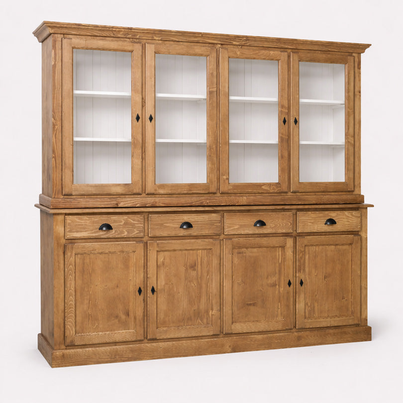 Vaisselier en pin massif avec quatre portes vitrées et rangements bas fermés.